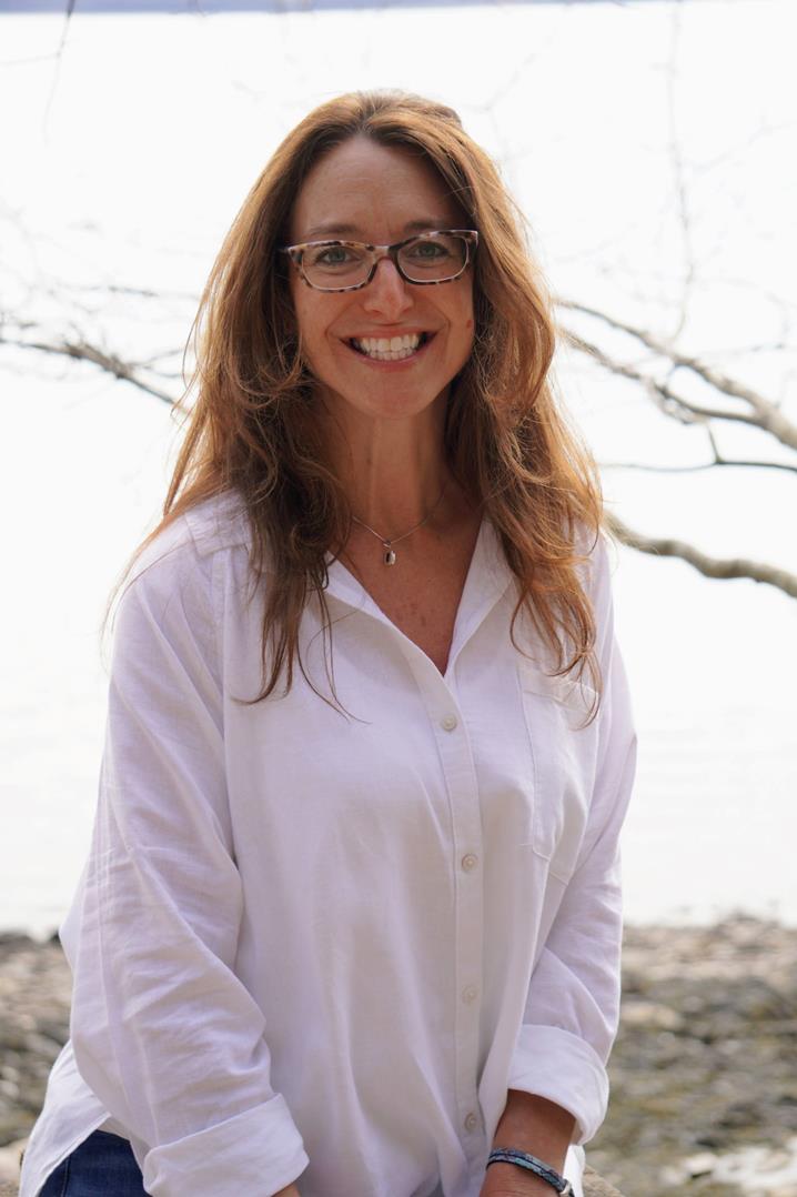 Michelle in a white button down shirt